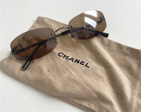 chanel brown sunglasses on face|Chanel rimless sunglasses.